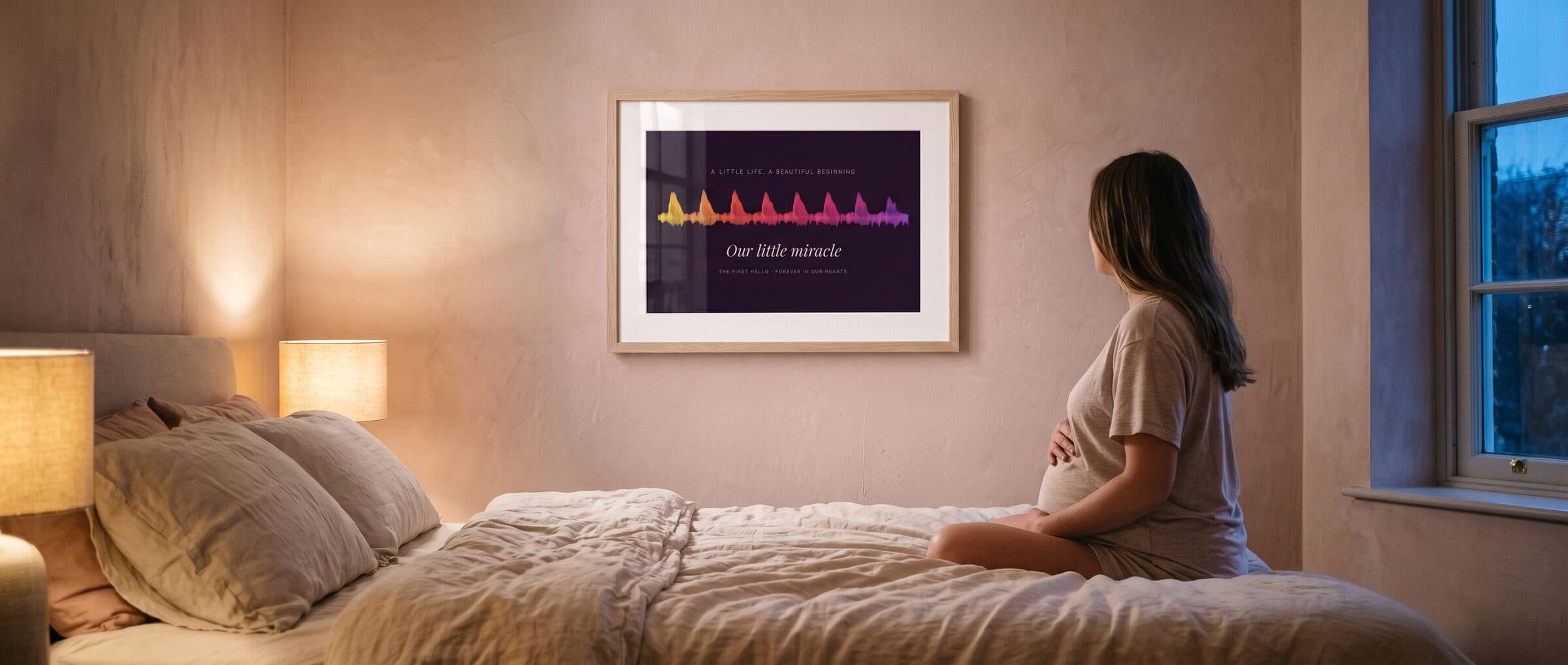 An expecting mother sitting on her bed, looking at a framed heartbeat print